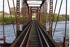 a photo of a railroad bridge